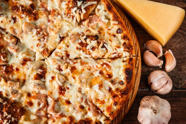 Appetizing fresh baked cheese pizza with garlic