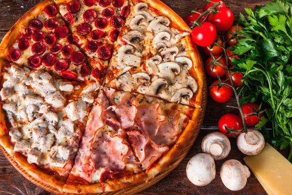 Italian pizza with meat and sausage on wood table
