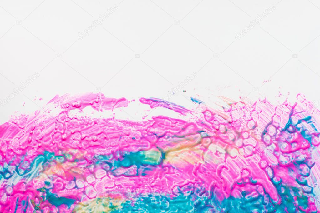 Pink and blue stains on white background