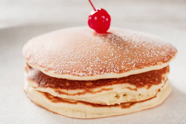 Cooking food. American pancakes with cherry — Stock Photo, Image