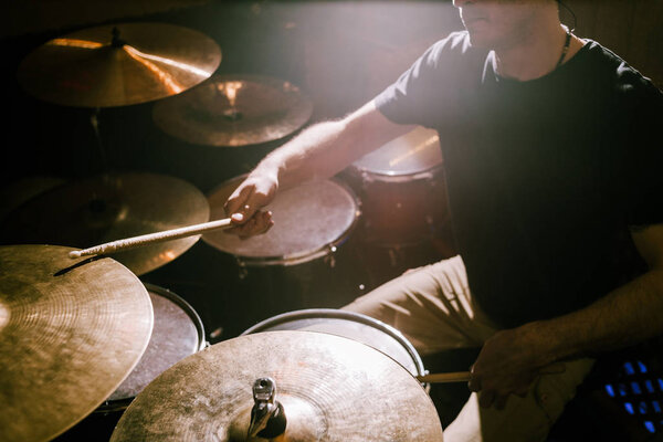 Drummer playing cymbals during concert