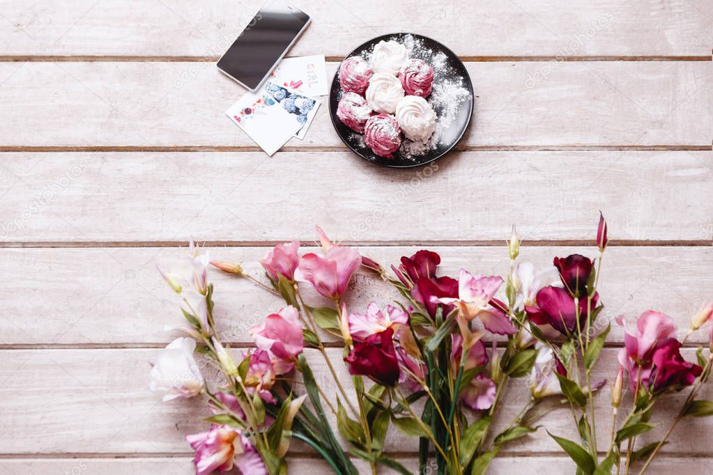 Sweet and blossomed background on wooden backdrop