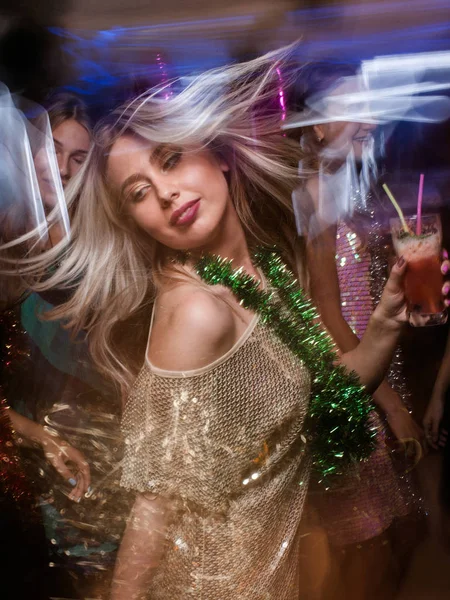 Female in night club in blurred motion — Stock Photo, Image