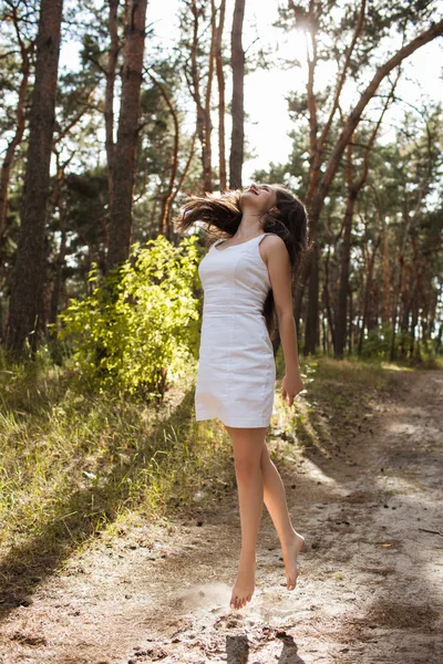 Healthy jumping woman nature happiness concept. Stock Photo