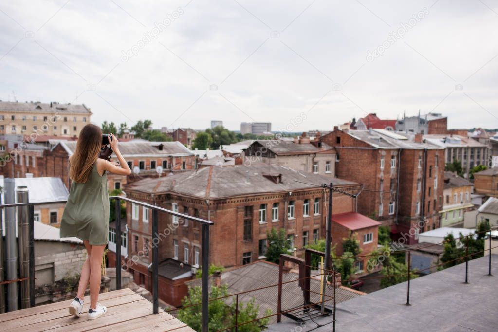 Cityscape woman photoshoot roof concept