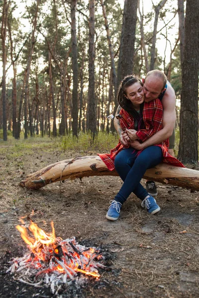 Couple love nature picnic bonfire forest concept.