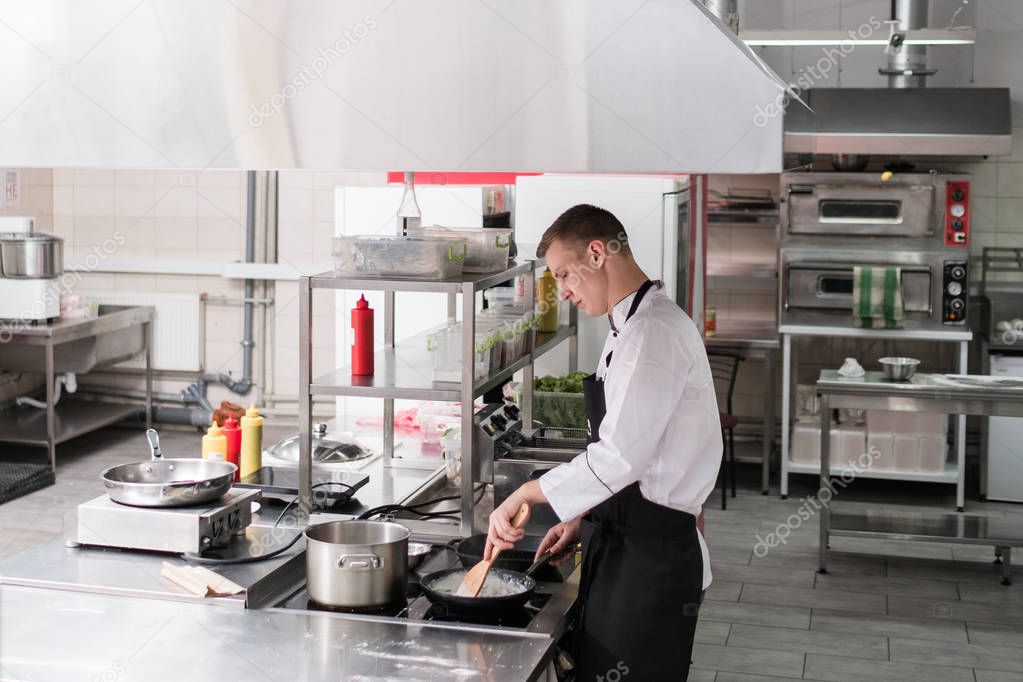 Restaurant kitchen interior workspace clean tidy — Stock