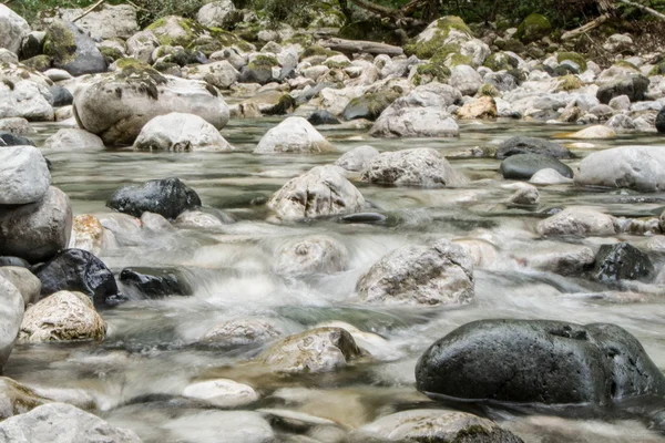 Water flow among stones in a mountain river