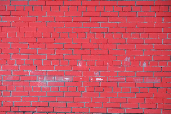 Le mur de briques rouges est en gros plan. Contexte de écarlate — Photo
