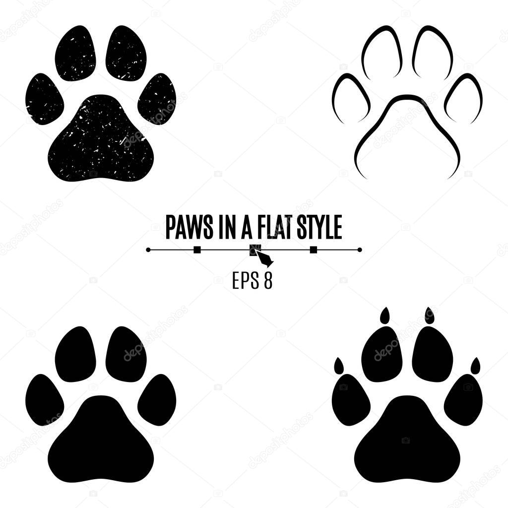 A set of dog's paws. Black traces in different styles. Isolated on white background. Silhouettes of paws