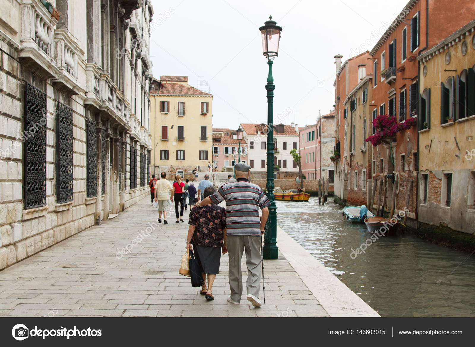Elderly Couple Walking Arm In Arm Through The Ancient Streets Of Stock Photo C Oksanastepova Elderly Couple Walking Arm In Arm Through The Ancient Streets Of Stock Photo C Oksanastepova