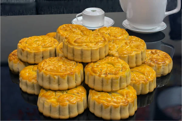 Vietnamese mid autumn festival cake. Mooncakes are traditional pastries eaten during the Mid-Autumn Festival. The festival involves family getting together to share mooncakes while watching the moon