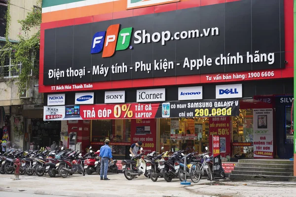 HANOI, VIETNAM - JUL 12, 2014: Front view of a mobile phone store of FPT Telecom in Hanoi capital. FPT is one of the biggest technology groups in Vietnam.