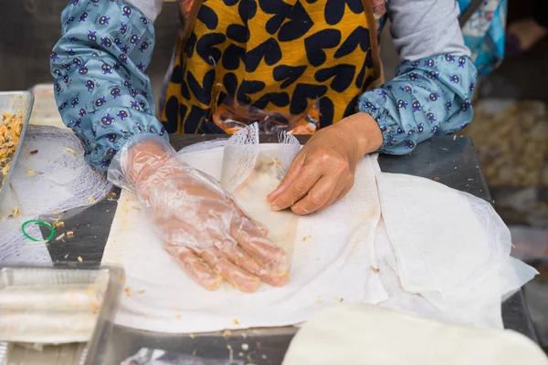 Making Vietnamese traditional spring rolls by hands