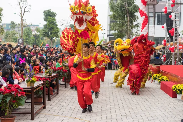 Hanoi, Vietnam - Feb 7, 2015: A show of lion and dragon dance at Vietnamese lunar new year festival organized at Vinschool, Vinhomes Times City, Minh Khai street