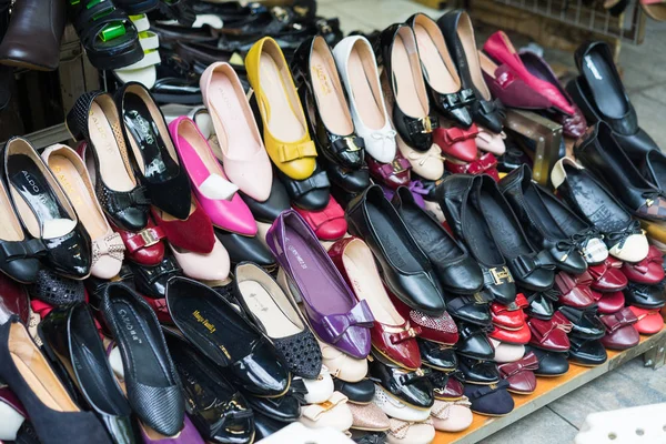 Hanoi, Vietnam - Mar 15, 2015: Various type of woman shoes for sale on a store in Hanoi