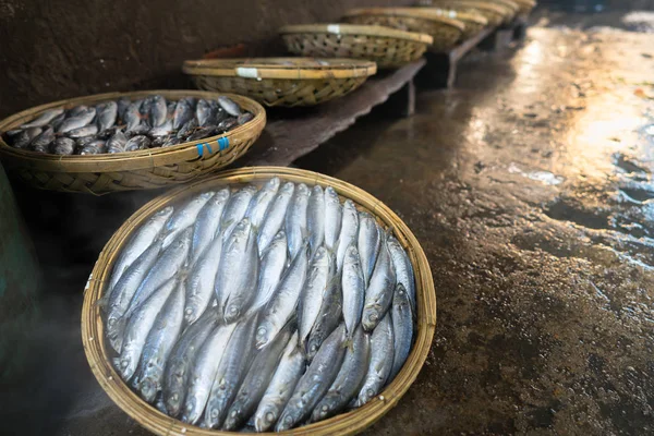 Boiled fish basket. Seafood processing at fish market in Quy Nhon, south Vietnam