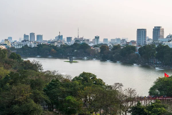 Aerial skyline view of Hoan Kiem lake or Ho Guom, Sword lake. Hoan Kiem is center of Hanoi city. Hanoi cityscape.