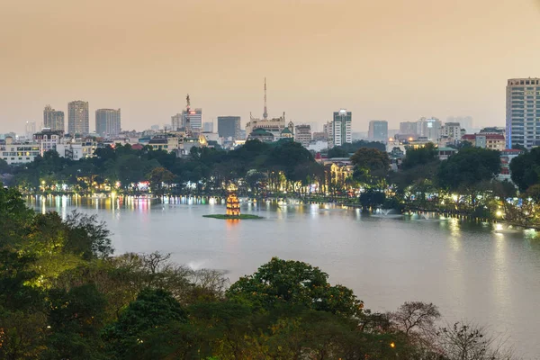 Aerial skyline view of Hoan Kiem lake or Ho Guom, Sword lake. Hoan Kiem is center of Hanoi city. Hanoi cityscape.