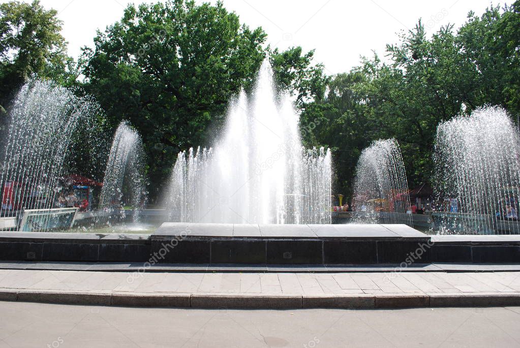large fountain in a city park on a summer day