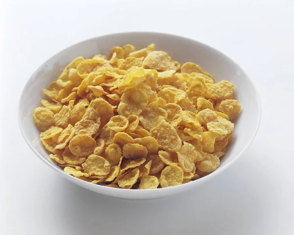 Dry cornflakes in bowl — Stock Photo, Image