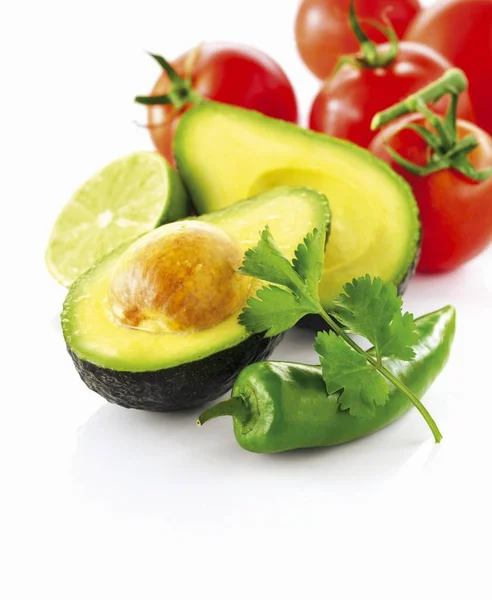 Avocado with tomatoes and chili pepper — Stock Photo, Image