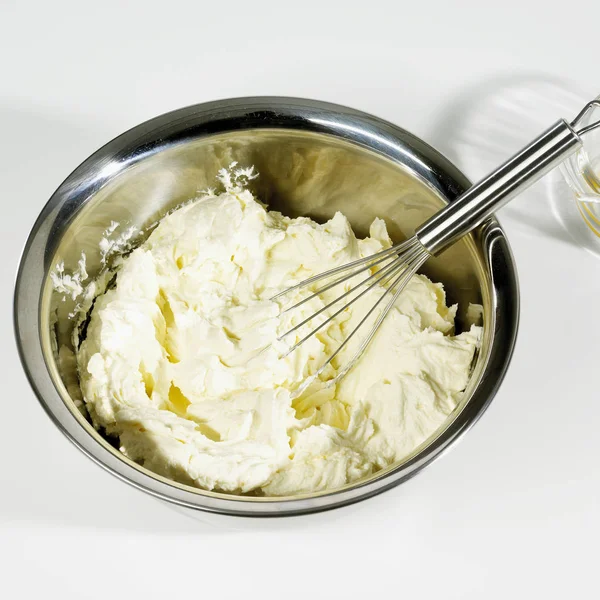Cheesecake mixture with whisk — Stock Photo, Image