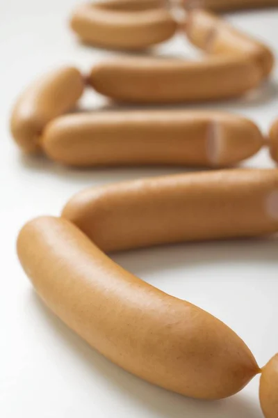 Lots of uncooked Frankfurters — Stock Photo, Image