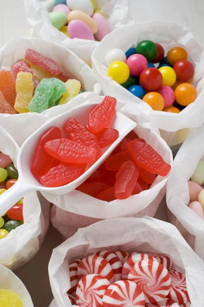 Assorted sweets in paper bags — Stock Photo, Image