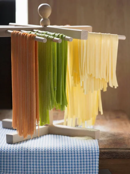 Homemade pasta hanging for drying — Stock Photo, Image
