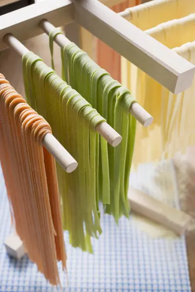 Homemade pasta hanging for drying — Stock Photo, Image