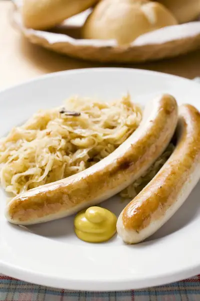 Sausages with sauerkraut and mustard — Stock Photo, Image