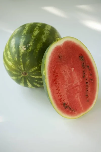 Half and whole ripe watermelons — Stock Photo, Image