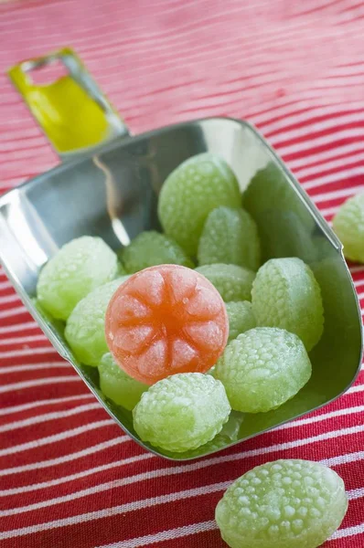 Green sweets in scoop — Stock Photo, Image