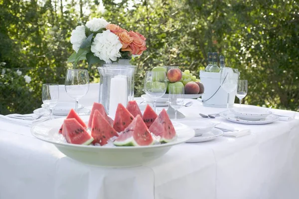 Watermelon slices served on dish at banquette table — Stock Photo, Image