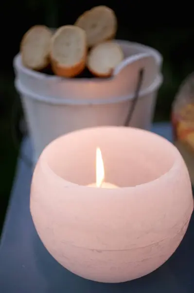 Closeup View Lit Candle Windlight Garden Table Baguettes Background — Stock Photo, Image