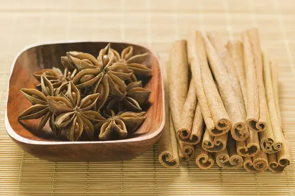 Star anise in wooden bowl — Stock Photo, Image