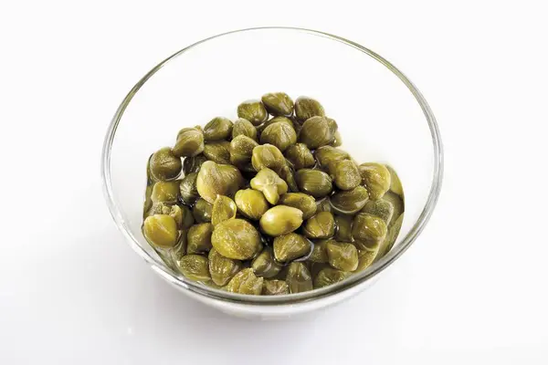 Pickled Capers in glass bowl — Stock Photo, Image