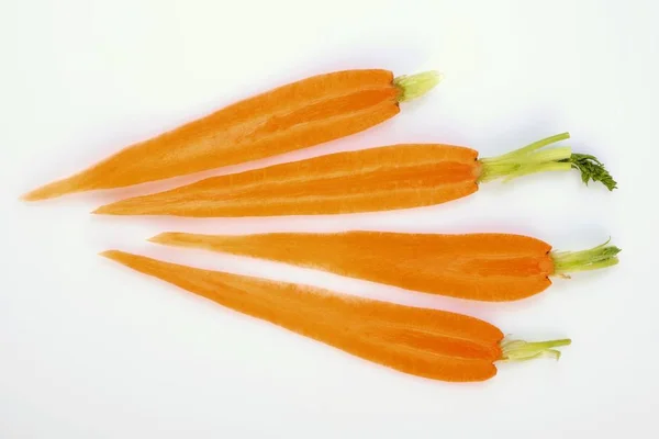 Slices of carrots with tops — Stock Photo, Image
