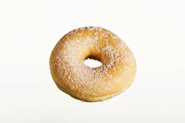 Sugared doughnut on white table — Stock Photo, Image