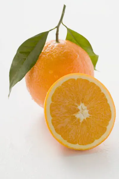 Orange with stalk and leaves — Stock Photo, Image