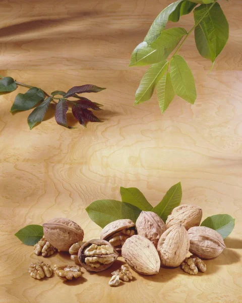 Walnuts on wooden surface — Stock Photo, Image