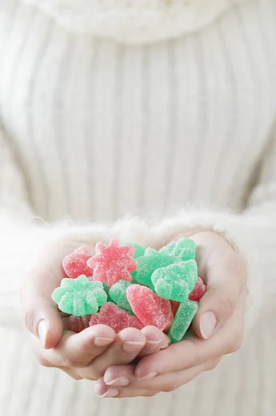 Woman holding jelly sweets — Stock Photo, Image