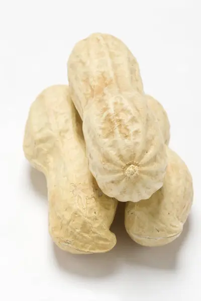 Three unshelled peanuts — Stock Photo, Image