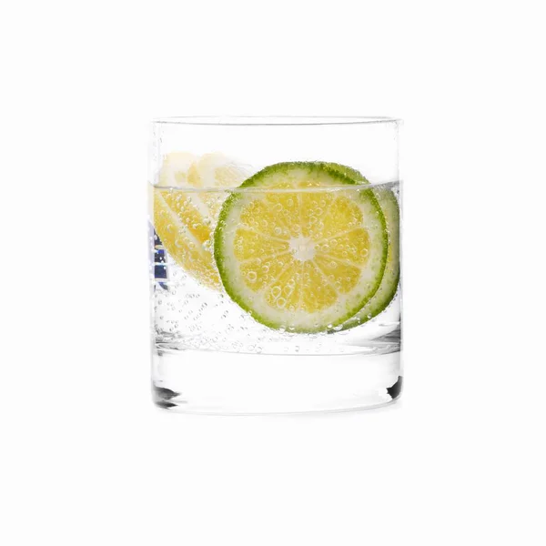 Glass of water with lime slices — Stock Photo, Image