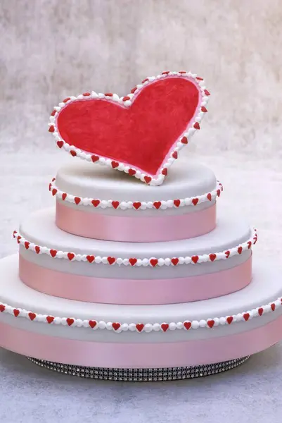 Three tiered cake with red heart — Stock Photo, Image