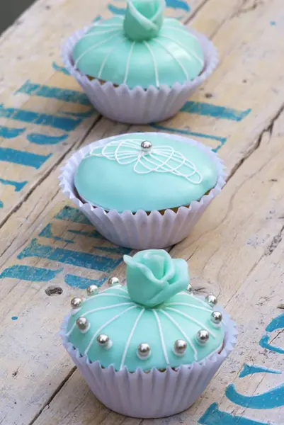 Three turquoise cupcakes — Stock Photo, Image