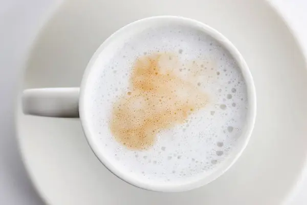 Cup of coffee with milk foam — Stock Photo, Image