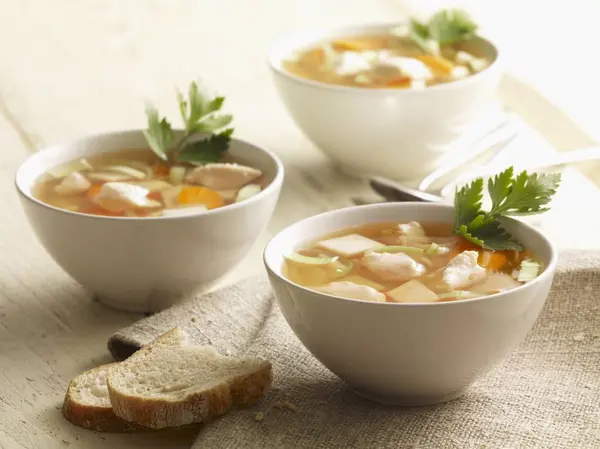 Chicken soup in white bowls — Stock Photo, Image