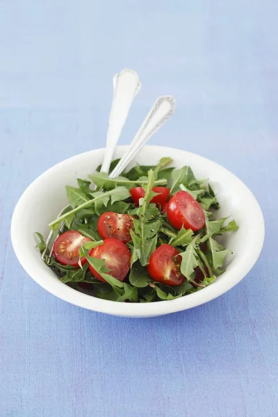 Dandelion Salad Cherry Tomatoes White Plate Blue Surface — Stock Photo, Image